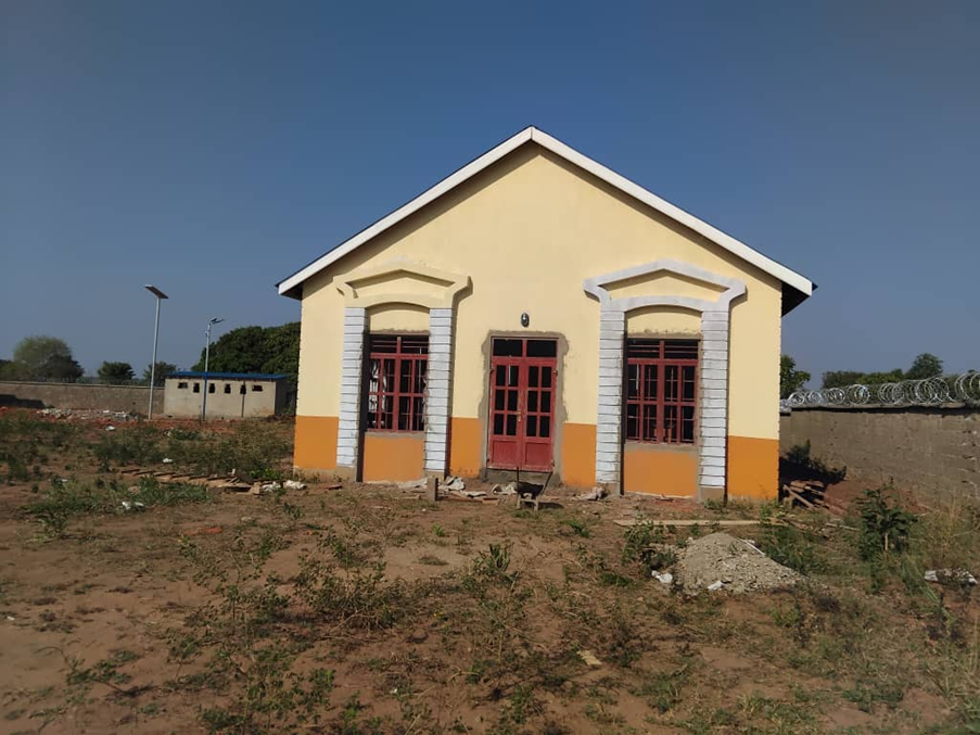 A finished Acholi Resilience building, awaiting furnishings and its first residents.
